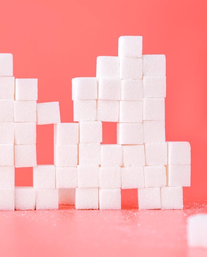 white sugarcubes on pink background