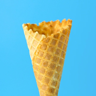 An ice-cream cone on blue background